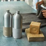 Eco-friendly Packaging - a couple of metal containers with metal objects on a table