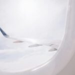 Packing Light - airplane flying over cloud during daytime