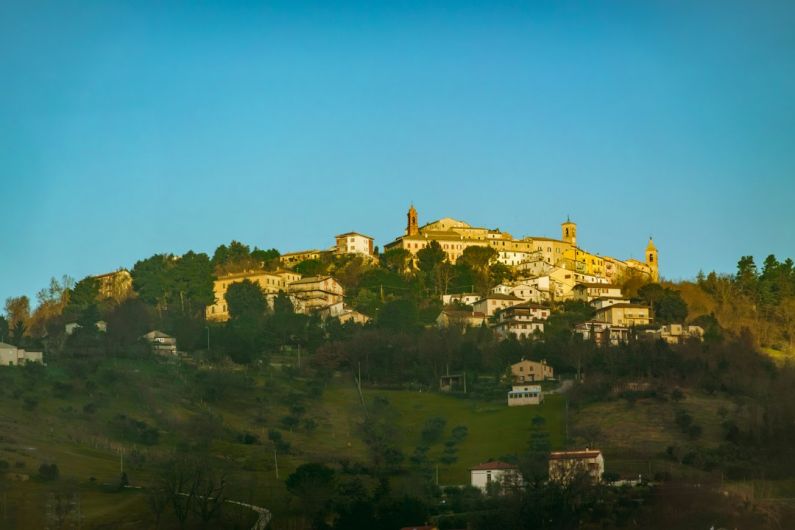 Cultural Travel - a hill with a village on top of it