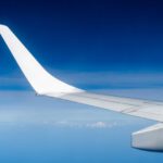 Overcoming Jetlag - a view of the wing of an airplane in the sky