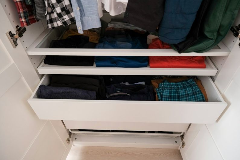 Clothes Storage - a closet full of clothes