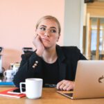 Overcoming Procrastination - woman in black long sleeve shirt using macbook