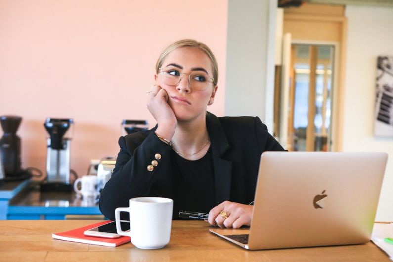 Overcoming Procrastination - woman in black long sleeve shirt using macbook