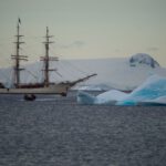 Mindful Living - a ship sailing in the ocean near icebergs