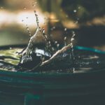 Water Saving - water drop on bucket photo