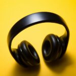 Gadget Protection - wireless headphones with yellow background