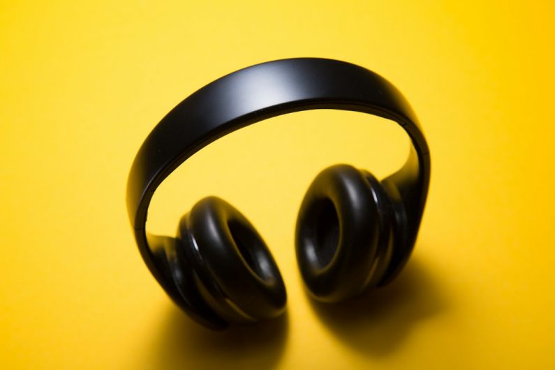 Gadget Protection - wireless headphones with yellow background