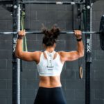 Fitness Trackers - woman doing weight lifting