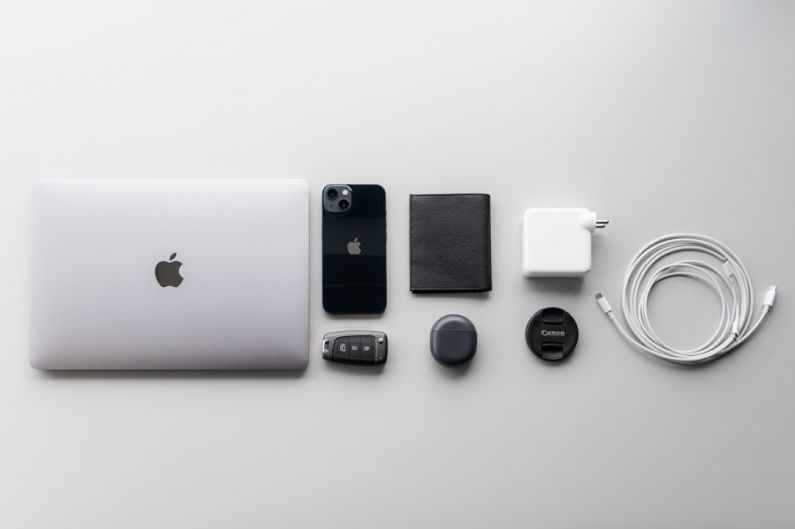 Car Gadgets - a white apple laptop sitting on top of a table