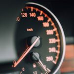 Car Audio Installation - closeup photo of black analog speedometer