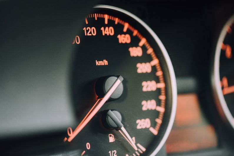 Car Audio Installation - closeup photo of black analog speedometer