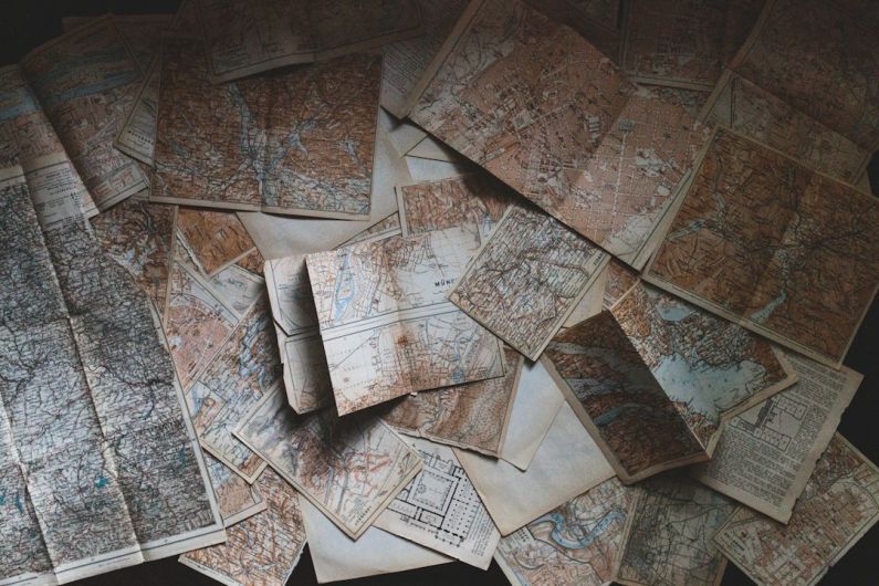 Road Trip Preparation - maps lying on the floor
